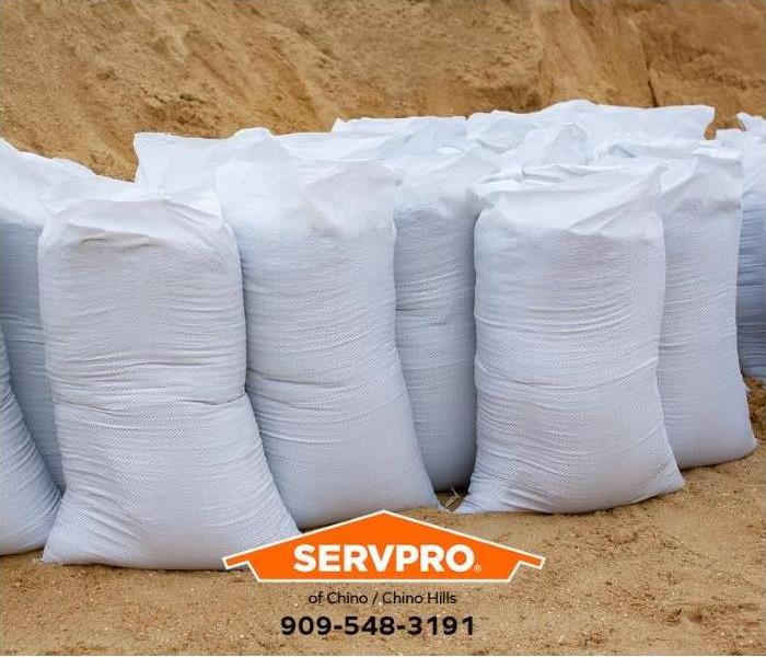 Sandbags stand in a row.