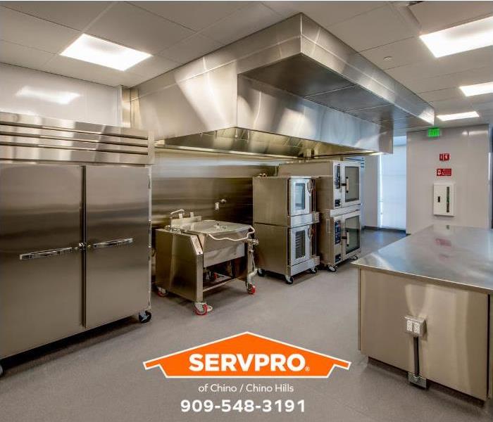A pristine commercial kitchen is shown.