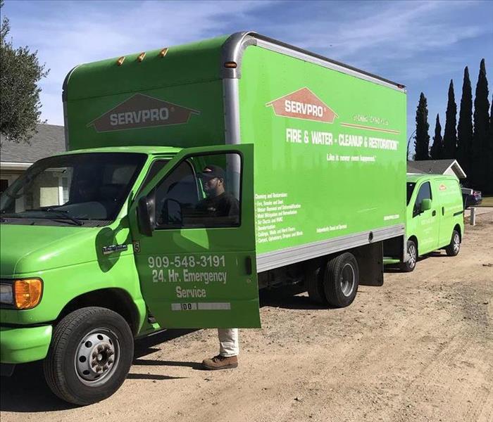 Green box truck and van